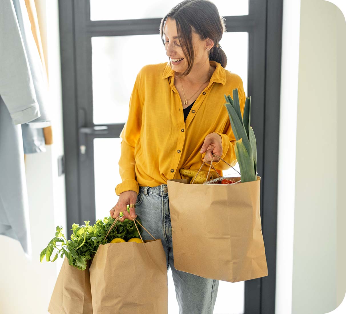 Lady bringing in her shopping to her cool house